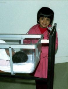 Young shamini with her baby sister