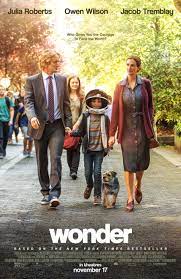 Film cover - a mother, father, two children and a dog walk down a street. 