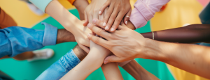 Everyone places their hand into the middle