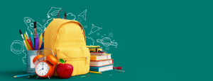 Yellow school backpack on a green background