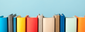Sky blue background with a row of colourful books.