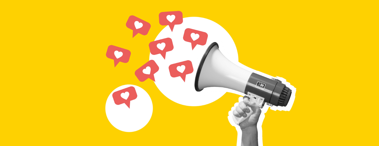 Megaphone with hearts falling out of it, against a yellow background