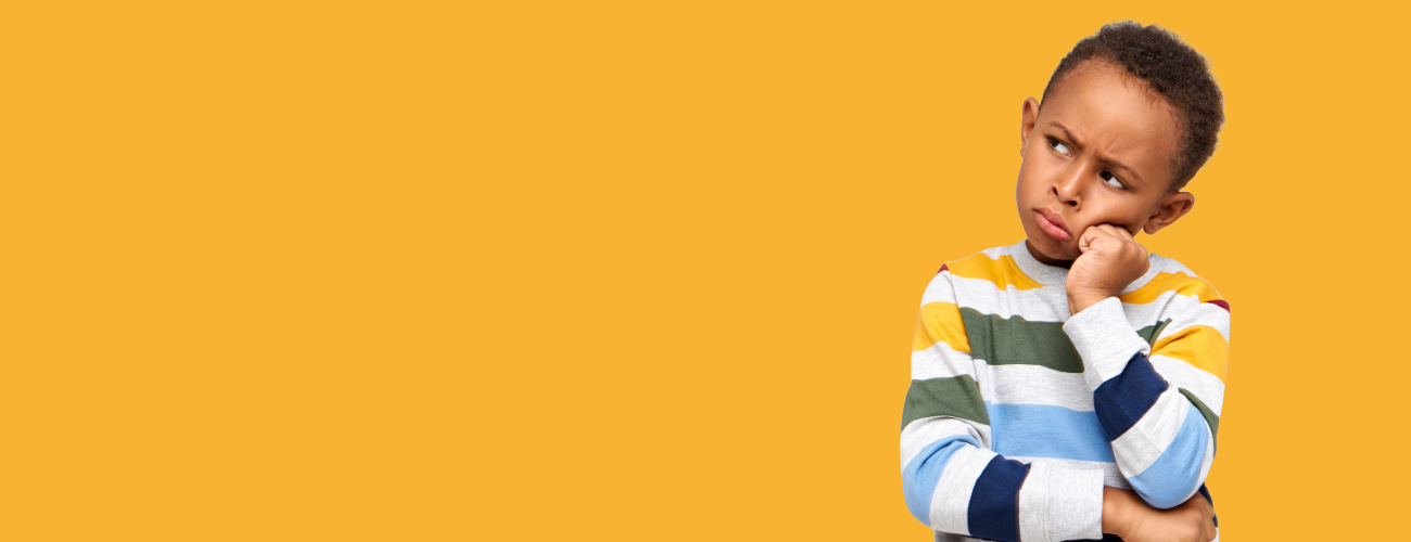 A child in a stripey jumper frowns and has a questioning expression. The background is bright yellow