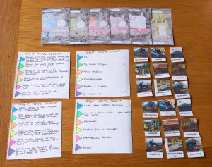 A selection of home made board game pieces, with a train theme